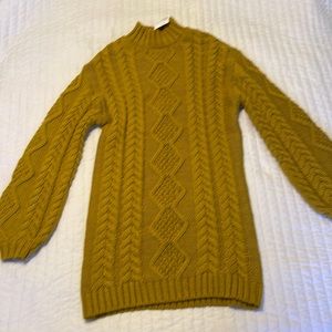 Tags still on sweater dress